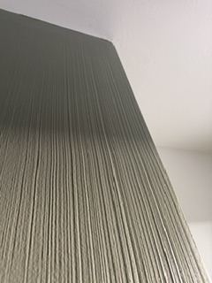 Close-up of a hand-applied texture finish on an interior wall